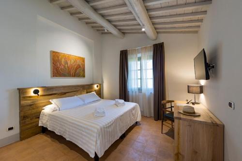 Кровать или кровати в номере Agriturismo Podere l'Aione