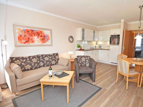 a living room with a couch and a table at Wohnpark Stadt Hamburg - Apt. 22 in Binz