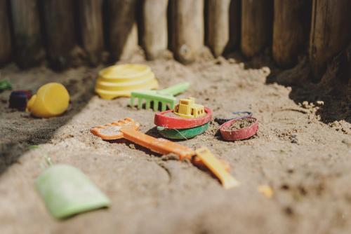 a pile of toys sitting on the ground at Hotel DIE SONNE in Saalbach Hinterglemm