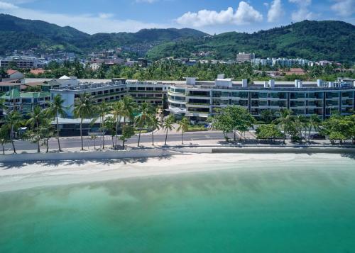 a large pool of water in front of a building at Homm Bliss Southbeach Patong in Patong Beach