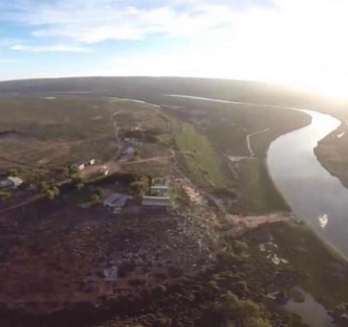 an aerial view of a river and a body of water at The love bubble in Lutzville