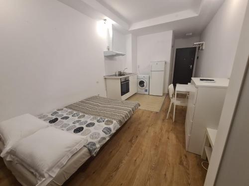 Postel nebo postele na pokoji v ubytování Cosmopolis Studio 1