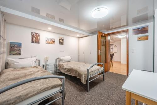 a hospital room with two beds and a hallway at Nice Private Apartment in Hannover