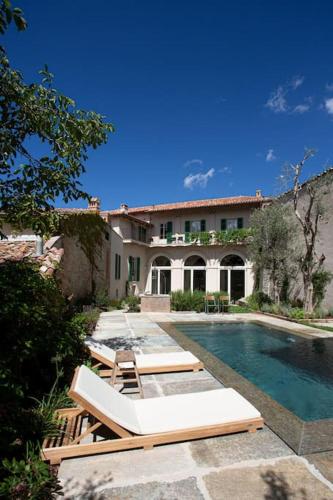 a house with a swimming pool and a building at Casa Mon in Monforte dʼAlba