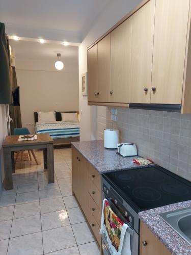 a kitchen with a sink and a stove top oven at ADLER 2 Cozy 2 persons apartment downtown Piraeus in Piraeus