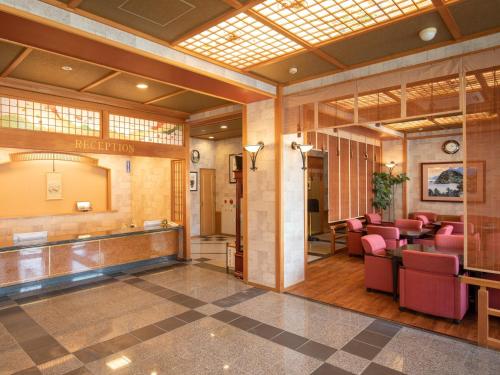 a salon with pink chairs and a waiting room at Hotel Castle Inn Ise Meotoiwa in Ise