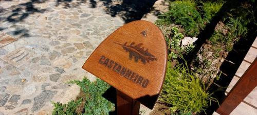 a wooden skateboard sitting on the side of a sidewalk at Green Paradise Glamping in Covas