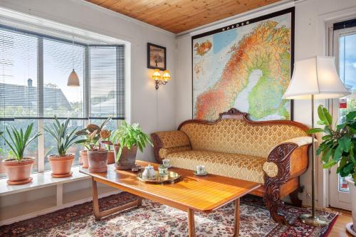 a living room with a couch and a table at Klara in Sandefjord