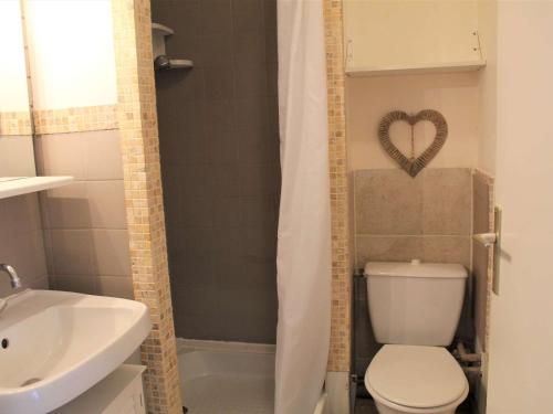 a bathroom with a toilet and a heart on the shower curtain at Studio cosy pour 2 à Vars Les Claux, proche des pistes et commerces - FR-1-330B-116 in Vars