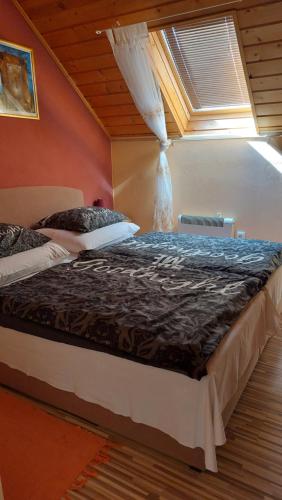 a bedroom with a large bed in a room at Víkendový Dom U Vasila in Krahule