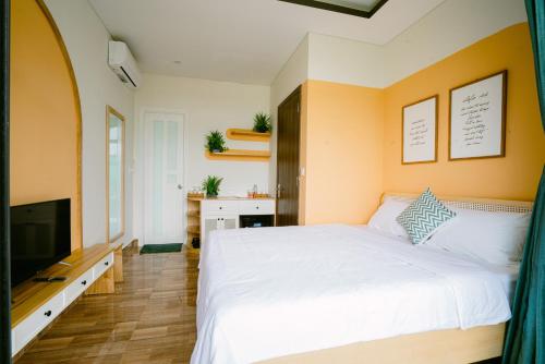Letto o letti in una camera di Mộc Homestay GrandWorld Phú Quốc