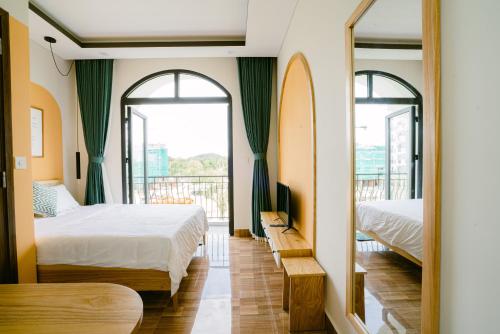 Letto o letti in una camera di Mộc Homestay GrandWorld Phú Quốc