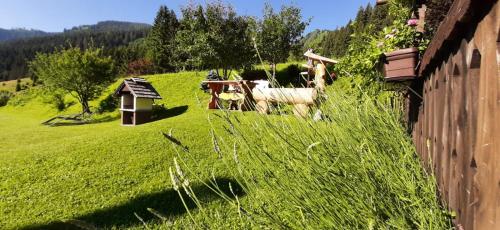 a couple of animals standing in a field of grass at Haus Fritz - Erholung in den Bergen in Donnersbachwald