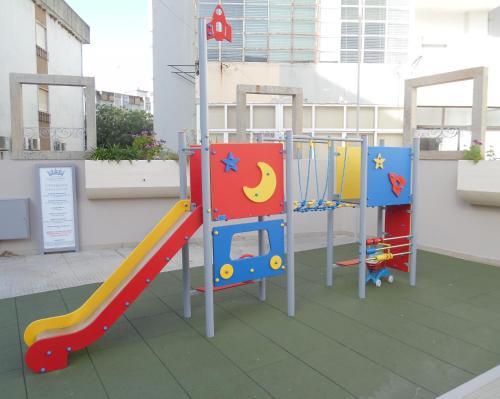 a small child's playground set up in a building at Hotel Rainha D. Amélia, Arts & Leisure in Castelo Branco