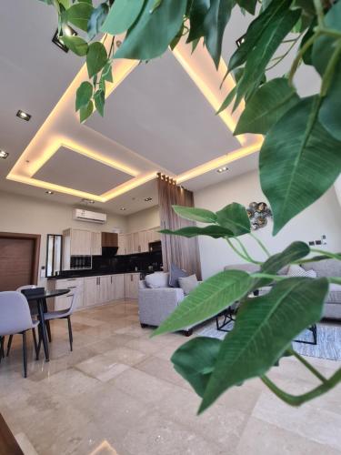 a living room with a couch and a table at Villa Bali Jeddah in Jeddah