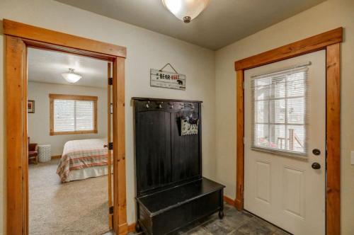 a room with a door leading to a bedroom at 1 Particular Pine by Casago McCall - Donerightmanagement in McCall