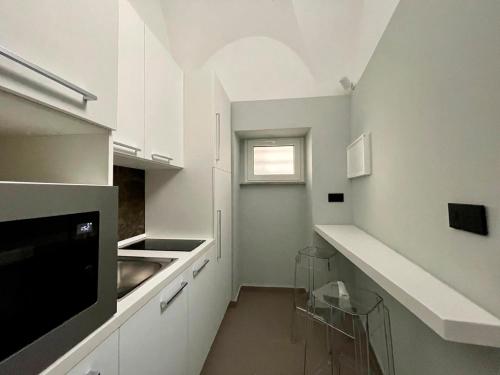Kuchyň nebo kuchyňský kout v ubytování Luxury Room Suites Benevento