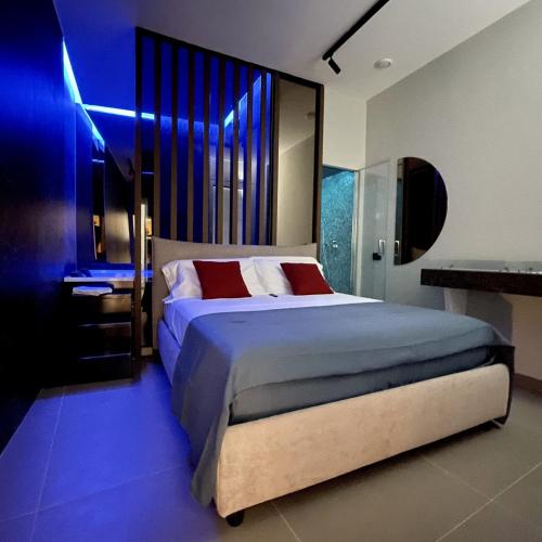 En eller flere senge i et værelse på Luxury Room Suites Benevento