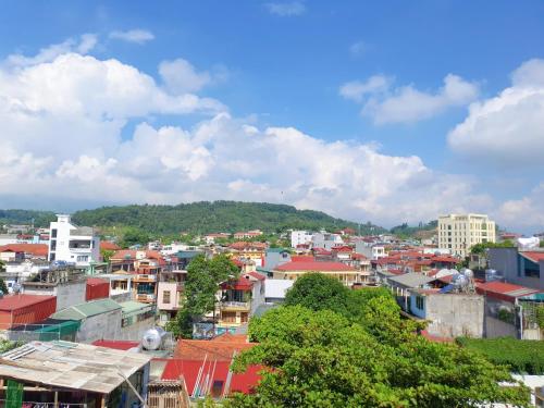 a view of a city with buildings and trees at Khách sạn Ngọc Hà in Lao Cai
