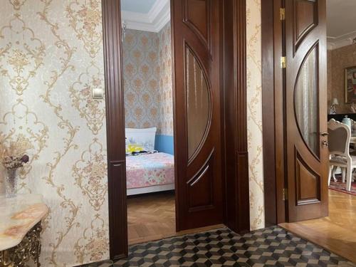 a hallway with a door leading to a bedroom at hotel castle in Kutaisi