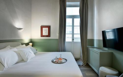 Letto o letti in una camera di ATHINAIDOS QUARTERS by K&K