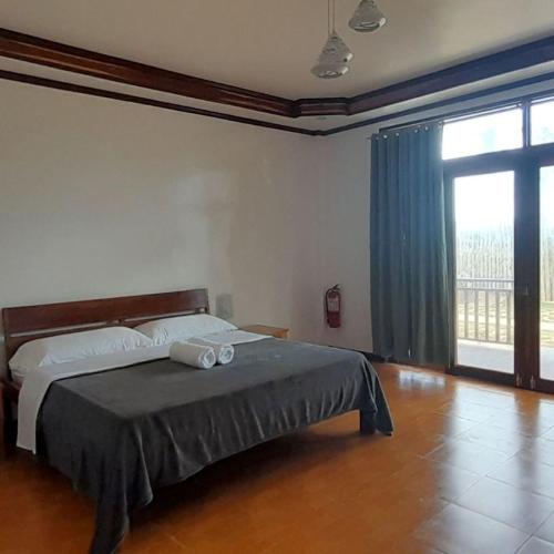 Postel nebo postele na pokoji v ubytování Takbo Beach Resort