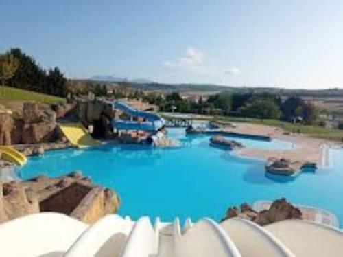 a water park with blue water and rocks at Ven y desconecta!! in Viana