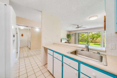a kitchen with a sink and a window at Kihei Gardens Estates G104 in Kihei