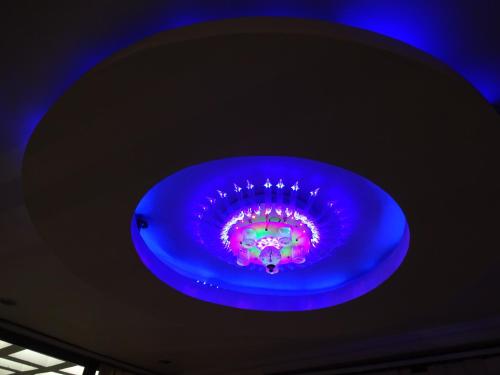 a blue ceiling with a purple light in a room at Hotel Viraat Inn in Gaya
