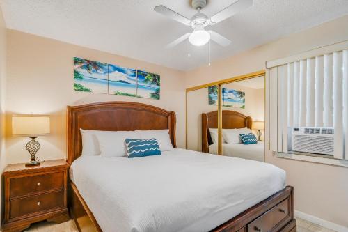 a bedroom with a bed and a ceiling fan at Kihei Gardens Estates G104 in Kihei