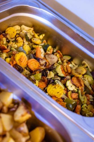 a container of food with vegetables in it at Hotel Veveří in Veverská Bítýška