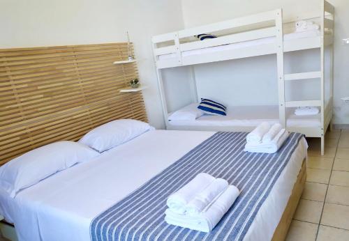 a bedroom with two bunk beds with towels at La Bagnante in Vasto