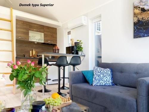 a living room with a couch and a table at LUXURY CAMP - 150 m od Suntago Park in Grabce-Towarzystwo