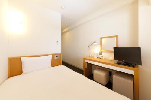 Postel nebo postele na pokoji v ubytování 7 Days Hotel
