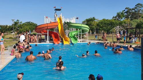 a group of people in a pool at a water park at LAS MARIAS - CHAJARI in Chajarí