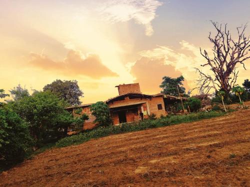 an old house on the side of a field at Maji Homestay Khajuraho in Khajurāho