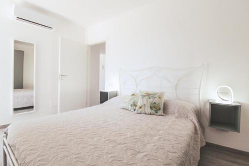 A bed or beds in a room at La Terrazza di Walter