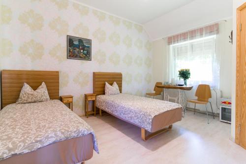Postel nebo postele na pokoji v ubytování Cērpas