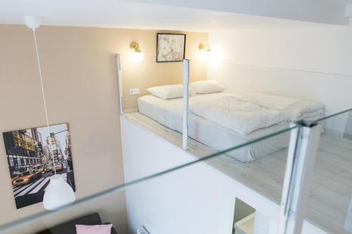 Posteľ alebo postele v izbe v ubytovaní Venus Apartments - Dohany Street III