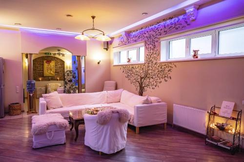 a living room with a couch and a table at Villa ROYAL CLUB 13 in Jūrmala