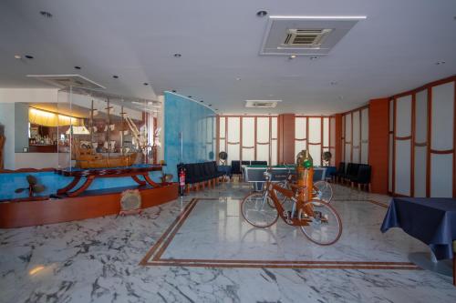a lobby with two bikes parked in a room at Best Western Hotel Nettuno in Brindisi