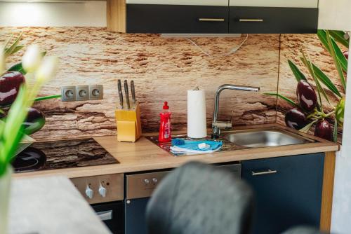 a kitchen with a sink and a counter top at Terrassenhaus Waldblick 637 in Hohegeiß