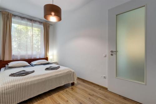 Katil atau katil-katil dalam bilik di Mohács Apartment with A/C