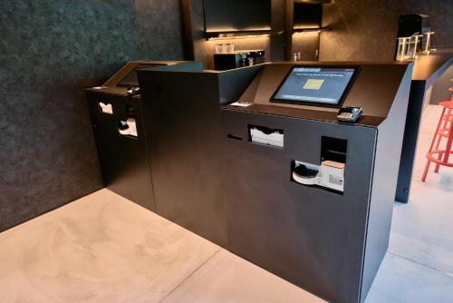 a kiosk with a laptop computer on top of it at fav HIROSHIMA STADIUM in Hiroshima