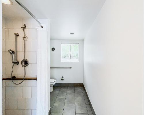 a bathroom with a toilet and a shower at Tranquilo in Fort Lauderdale