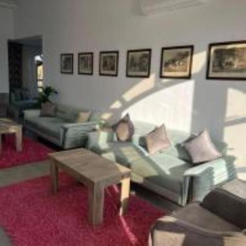 a living room with a couch and a coffee table at Golden Lake Marina Hotel in El Alamein