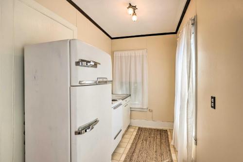 a white refrigerator in a kitchen with a window at Sodus Point Escape - Walkable to Lake Ontario in Sodus