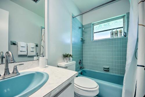 a bathroom with a sink and a toilet and a tub at Port Charlotte Retreat about 4 Mi to Beach Park! in Port Charlotte