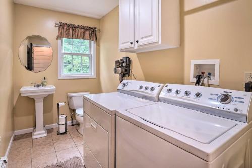 a laundry room with a washer and dryer at Lakefront Homer Abode with Patio and Backyard! in Homer