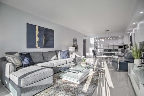 a living room with a couch and a table at Less Than Half-Mi to Beach Sunny Isles Resort Condo in Miami Beach